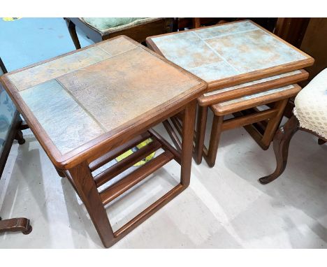 A nest of mid 20th century teak, tile top tables and another tile top table 