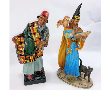 A Royal Doulton figure:&nbsp; Carpet Seller HN 1464; a Royal Doulton resin figure:&nbsp; Wizard &amp; Owl 