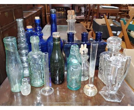A Showell's Stockport Brewery vintage bottle, a selection of similar vintage bottles and Bristol blue glass bottles