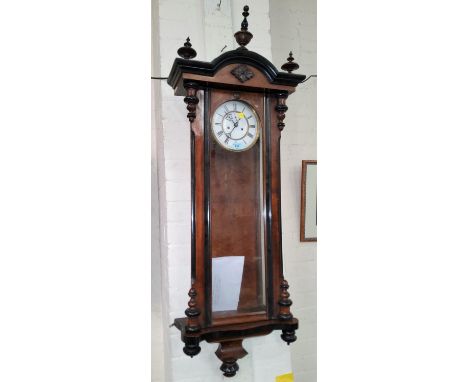 A 19th century Vienna wall clock, with turned finials and mounts, double weight driven striking movement 