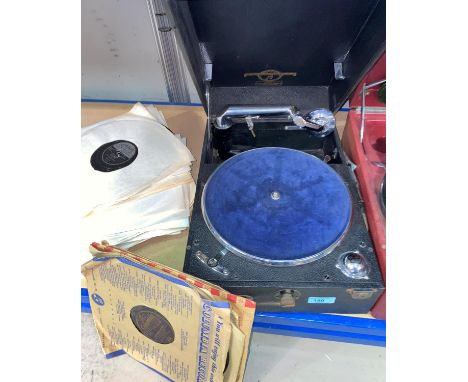 A Columbia portable record player and a selection of vintage records 