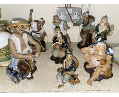 A selection of Chinese ceramic fishermen. 