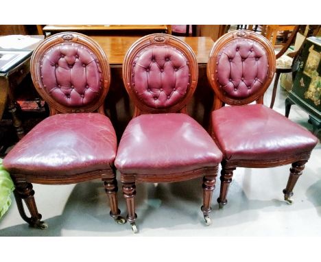 Six&nbsp; mahogany balloon back chairs with leather button backs and overstuffed leather seats in red.&nbsp;&nbsp;Please note