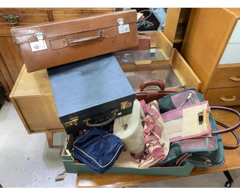 A tan leather suitcase; a ladies travel case; a large quantity of vintage bags, purses etc 