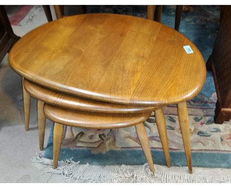 A set of light wood ERCOL pebble, nest of three stick leg tables.&nbsp;Good condition, with one noticeable but not serious 4c