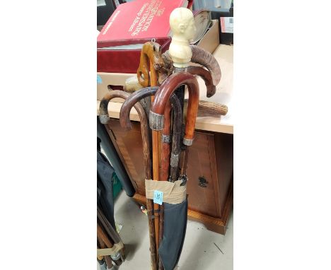 A quantity of vintage walking sticks 