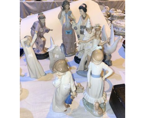 A Nadal pair of porcelain figures of Japanese girls; 4 Nao figures; a Lladro group:&nbsp; clown and dancer (slight a.f.); a f