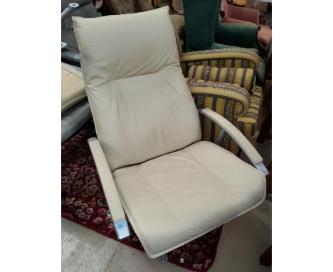 A swivel armchair and pouffe in cream hide by John Lewis 
