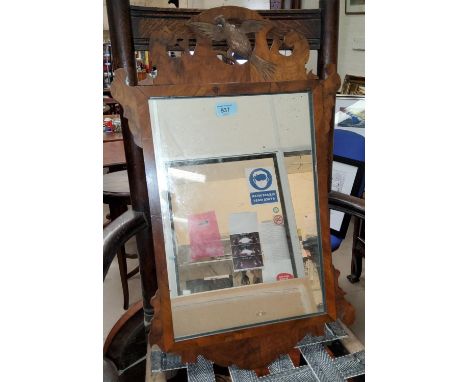 A Chippendale style wall mirror in a walnut fretwork frame, height 66cm. 