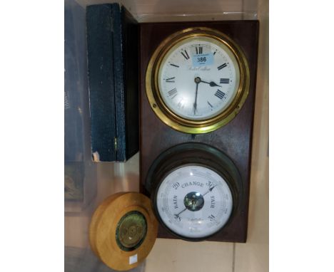 A clock/barometer set mounted on mahogany plaque; a perpetual calendar 