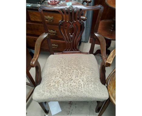 A 19th century pair of mahogany Chippendale style armchairs with pierced vase splats and overstuffed seats, on square chamfer