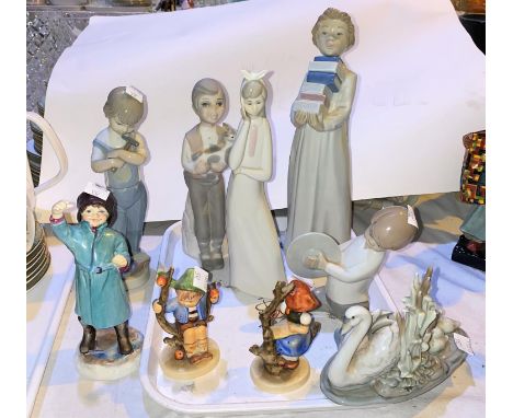 Two Lladro figures of boys; a Nao figure of a boy with books; a Royal Worcester figure "April"; 2 Hummel figures; etc.&nbsp;&