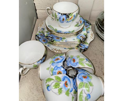 An early 20th century Grafton China part tea service decorated with blue flowers 