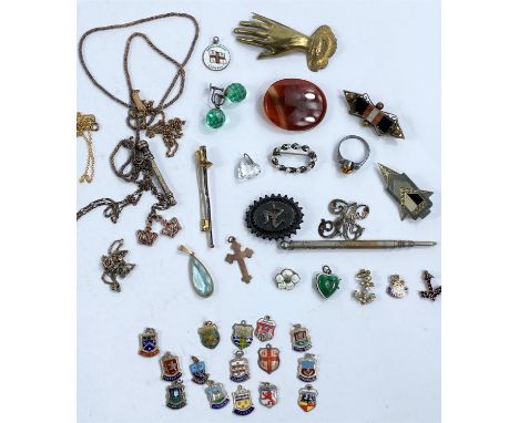 A selection of small costume jewellery, enamel badges etc. 