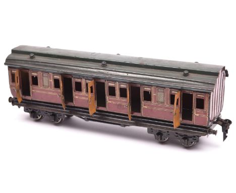 A Marklin O gauge tinplate Midland Railway bogie coach. Composite First Third coach in lined maroon livery with dark grey roo
