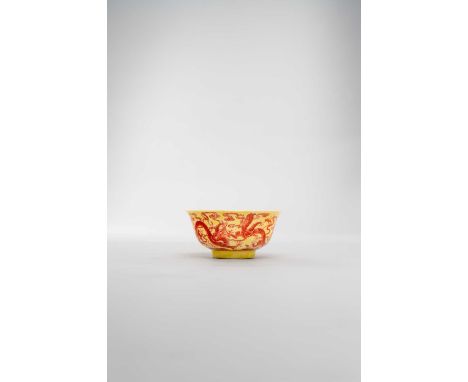 A RARE CHINESE YELLOW-GROUND AND IRON-RED DECORATED 'DRAGON' BOWL SIX CHARACTER QIANLONG MARK AND PROBABLY OF THE PERIODThe d