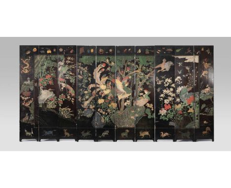 A CHINESE TEN-PANEL COROMANDEL LACQUER ‘BAINIAO CHAOFENG’ SCREENKANGXI 1662-1722Finely carved and vibrantly decorated on one 