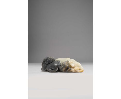 A LARGE CHINESE GREY AND PALE CELADON JADE CARVING OF AN ELEPHANT AND A LION DOGQING DYNASTY OR LATEREach beast recumbent and