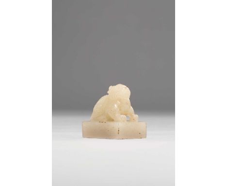 A CHINESE PALE CELADON JADE SEAL QING DYNASTYCarved with a crouching luduan, the rectangular seal face carved with Jiusi Zhur