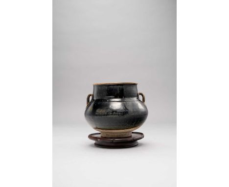 A CHINESE HENAN-TYPE BLACK GLAZED JAR JIN DYNASTYThe globular body with a tapering cylindrical neck, two strap handles and co
