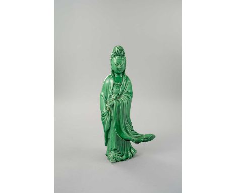 A RARE CHINESE GREEN GLAZED FIGURE OF GUANYIN REPUBLIC PERIODThe Goddess stands with a serene expression, holding a flask, we