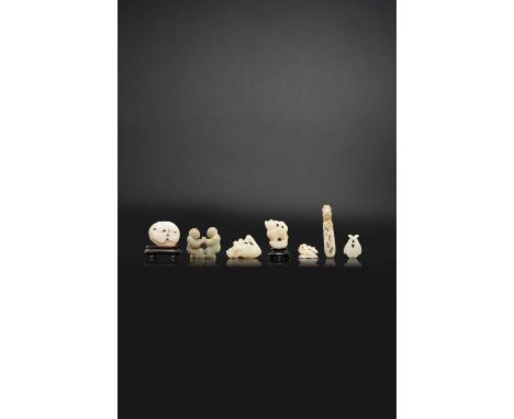 SEVEN SMALL CHINESE CELADON JADE CARVINGS18TH AND 19TH CENTURYOne of a seated crane holding a peach branch and with a smaller