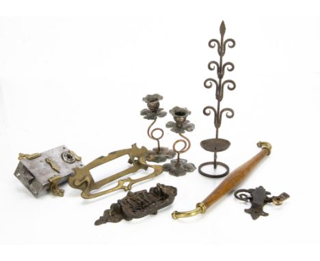 A miscellaneous collection of metalware, including a pair of Arts and Crafts candlesticks with quatrefoil bases and sconces, 