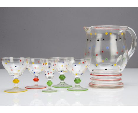 A part Art Deco lemonade and liquor set, including  a shaped jug with loop strap handle, 27cm high, and four matching harlequ