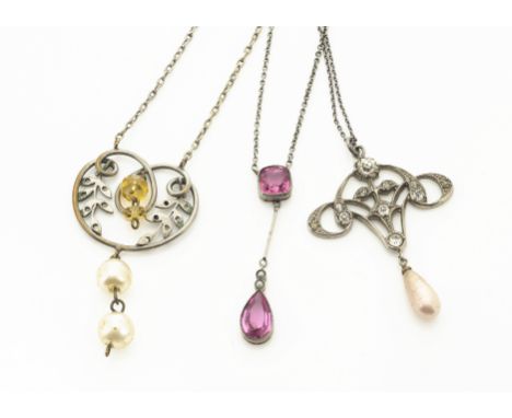 An Art Nouveau style paste set pendant, with simulated pearl drop, another similar and a drop pendant with paste stones (3) 