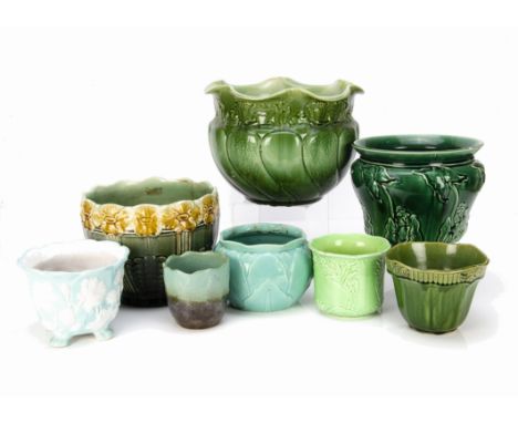 A collection of eight various British pottery and stoneware moulded jardinieres, in green and blue, the largest having moulde