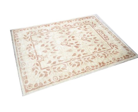 A contemporary Ziegler type woollen rug, the rectangular shape with central panel with repeating floral decoration against a 