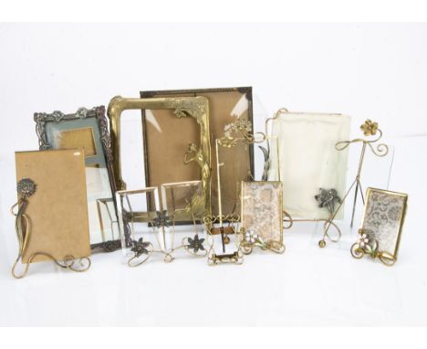 A collection of continental wire work and brass and base metal picture frames, including a pair of miniature wirework frames 