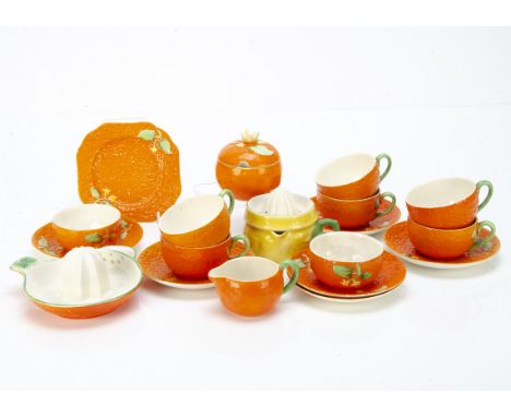 A Crown Devon orange moulded and pattern part tea set, comprising six cups, six saucers, one side plate, one jar and cover, s