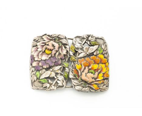 An early 20th Century white metal and enamel belt buckle, with orange and mauve enamel decorated flowers, heightened green le