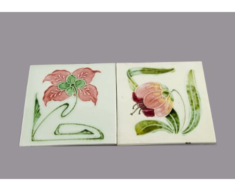 Two German Art Nouveau tiles, relief moulded by Haager Horth, floral decorated in colours against green ground, 15cm square M