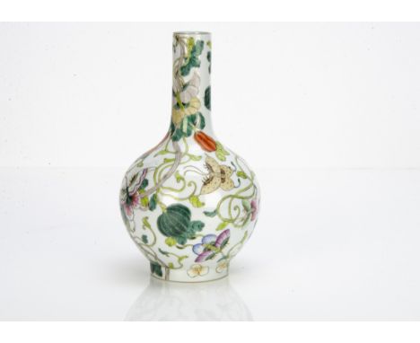 A Chinese famille verte Kangxi style bottle vase, the white ground with polychrome decoration of butterflies in famille rose 