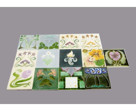 A collection of thirteen continental Art Nouveau relief moulded floral tiles, by various makers all with floral decoration, i