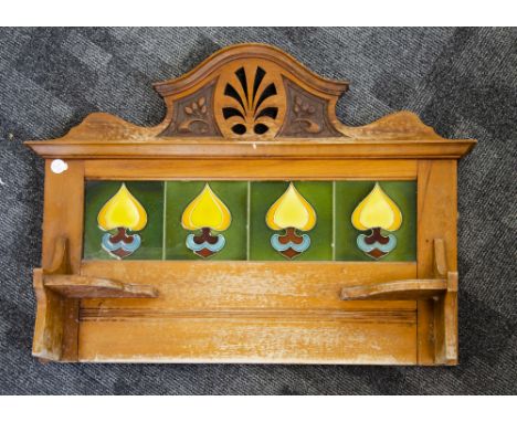 A stained beech and Art Nouveau tile washstand back, the four stylised floral yellow, orange, brown and blue tiles within an 