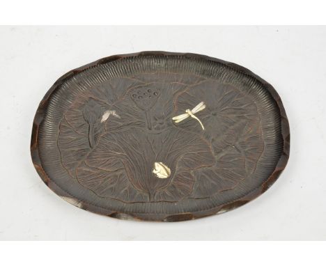 A Japanese Meiji period shibiyama tray, the hardwood carved tray with lotus flower and leaves decorated with mother of pearl 