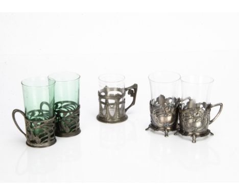 A pair of Orivit pewter Jugendstil glass or cup holders, decorated with pierced design of flower heads and whiplash stems wit