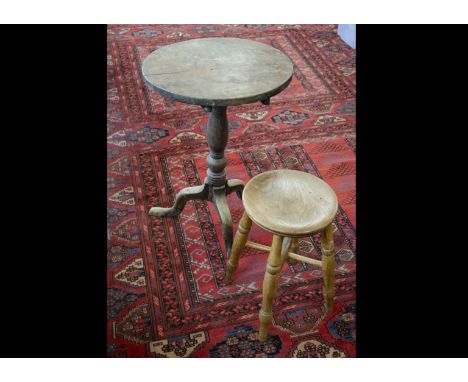 A 19th Century mahogany tilt top table, the turned pedestal on cabriole tripod supports, circular top, 51cm diameter together