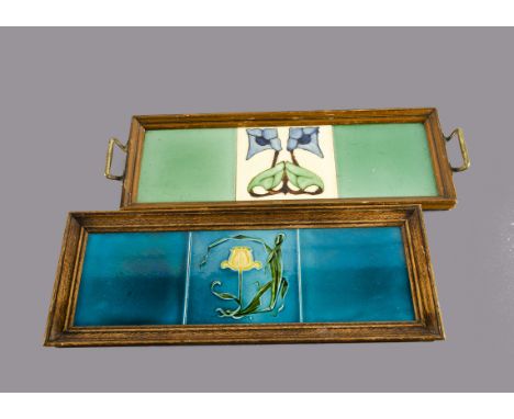 A British Art Nouveau relief moulded framed tile panel, with central daffodil decoration by Alfred Meakin within an oak frame