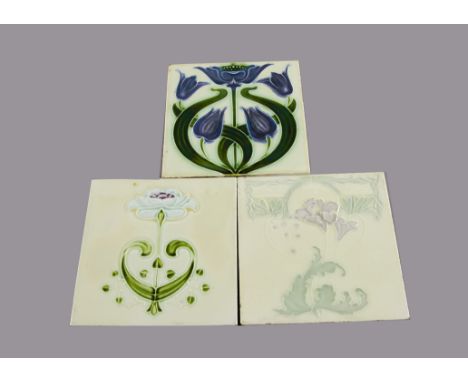 Three Alfred Meakin relief moulded Art Nouveau tiles, all with purple flowers, 15cm square One crazed^ minor knocks to edges
