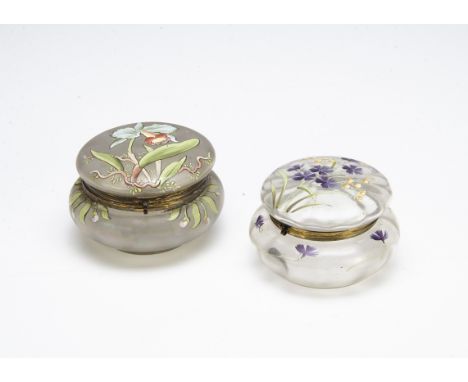 Two continental glass Art Nouveau dressing table jars and covers, one with enamel decoration in the manner of Mont Joye with 