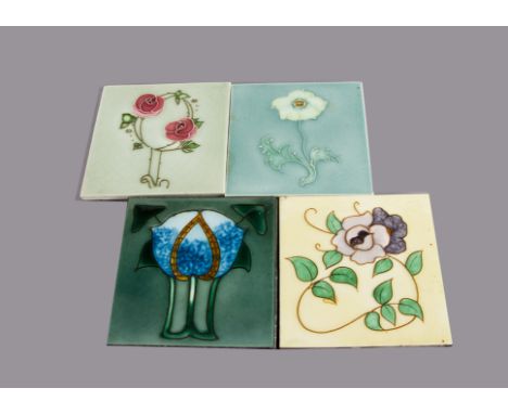 Four Henry Richards tube lined Art Nouveau tiles, all with stylised floral design, painted in colours, one with metal frame f