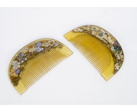 Two Japanese Meiji period horn and mother of pearl Kushi Kanzashi combs, of half moon design with fine teeth inlaid with moth