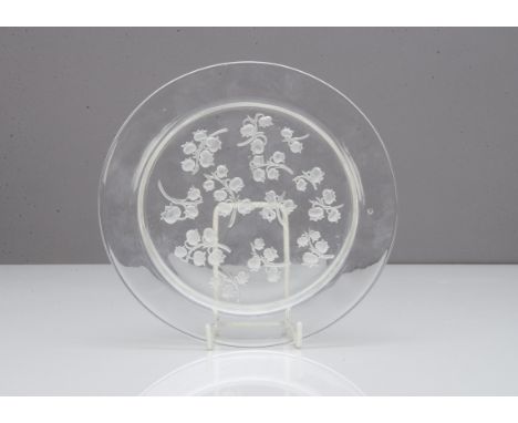 A Rene Lalique salad plate, Muguet pattern, the clear glass circular plate with moulded decoration to underside with lily of 