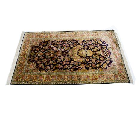 A Middle Eastern silk prayer rug, the all over floral decoration with  a large urn of multiple flowers sprouting more flowers