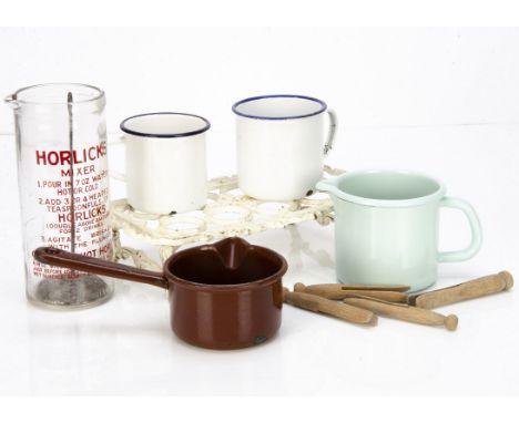 A collection of kitchen items, including a cast iron egg stand for eight eggs on a pierced rectangular framework with bracket