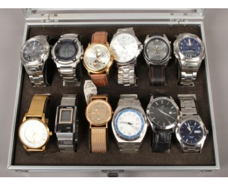 A watch case and contents of quartz and automatic wristwatches including Casio, Earnshaw, Christin Lars etc.